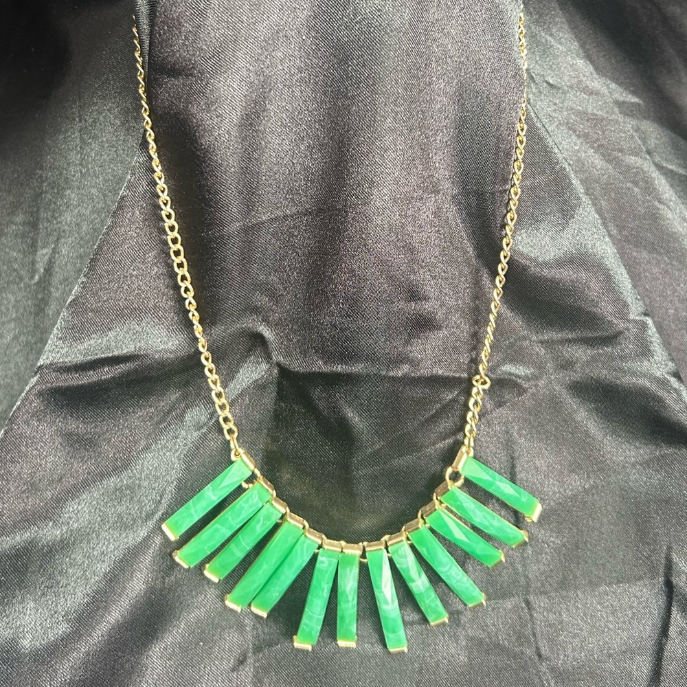 Women’s gold tone and green gem necklace